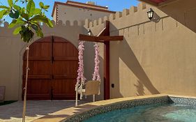 بيت أرض الثراء Rich Land House